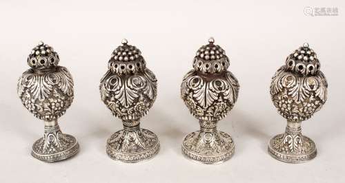 FOUR INDIAN SOLID SILVER SALT AND PEPPER SHAKERS, embossed with flowers and leaves, each approx.