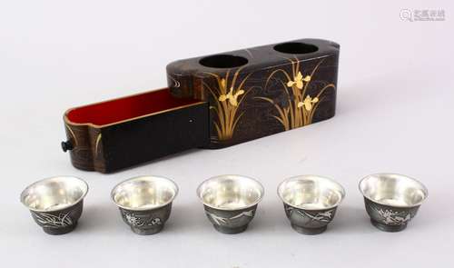 A GOOD JAPANESE MEIJI PERIOD LACQUER SAKE BOX & FIVE MARKED WHITE METAL CUPS, the box finely