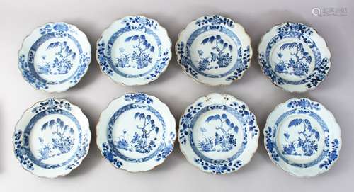 EIGHT 18TH CENTURY CHINESE BLUE & WHITE PORCELAIN PLATES, each dish decorated with floral borders