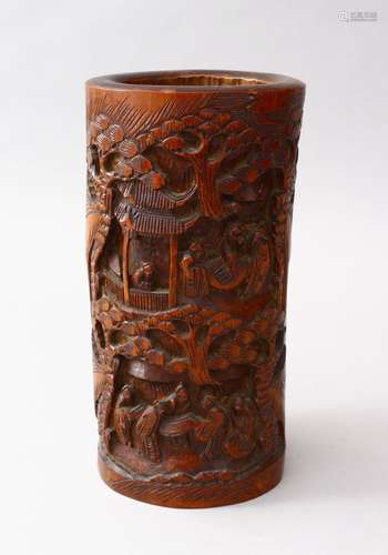 A 19TH CENTURY CHINESE CARVED BAMBOO BRUSH POT, the body of the pot carve in deep relief to depict