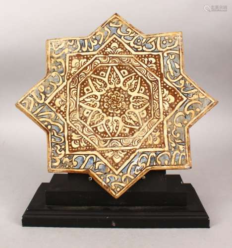 AN ISLAMIC EIGHT-POINTED STAR TILE with stand, the tile with calligraphy, 32cm x 32cm.