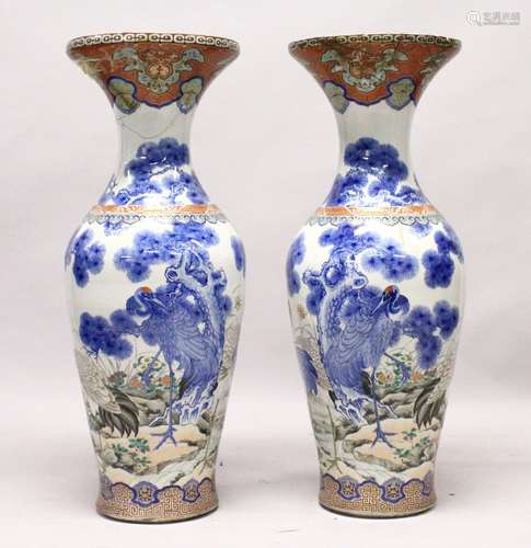 A LARGE PAIR OF JAPANESE MEIJI PERIOD BLUE AND WHITE PORCELAIN IMARI VASES, the bodyt of the vases