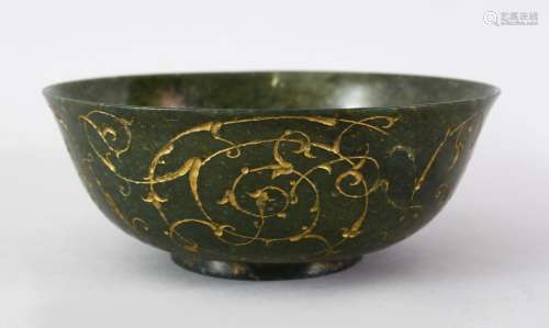 A FINE QUALITY 18TH / 19TH CENTURY ISLAMIC CARVED AND GILT DECORATED GREEN SPINACH JADE BOWL, the