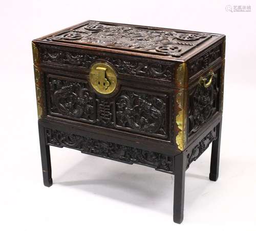 A GOOD 19TH CENTURY CHINESE CARVED HARDWOOD / HONGMU DRAGON CARVED LIDDED CHEST, the panels of the