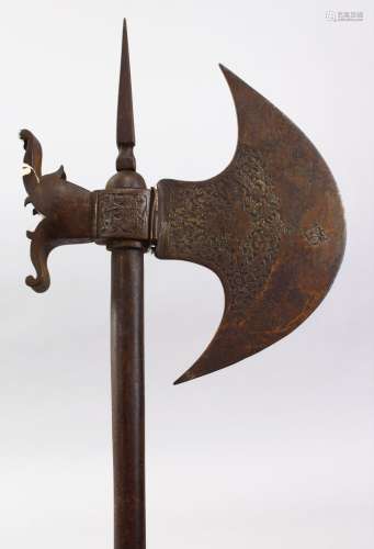A GOOD 19TH CENTURY PERSIAN QAJAR ENGRAVED STEEL AXE, 84cm long,