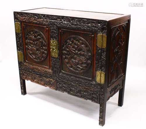 A LOVELY 19TH CENTURY CHINESE HARDWOOD / HONGMU CARVED DRAGON TWO-DOOR CABINET, the door panels