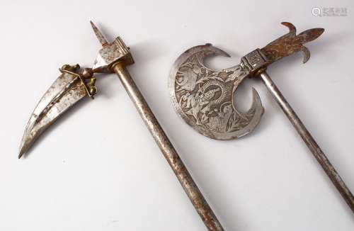 TWO 18TH / 19TH CENTURY INDIAN STEEL AXE'S, The largest: 62cm, the smaller: 53cm.