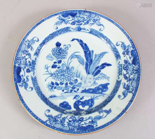 A 19TH CENTURY CHINESE BLUE & WHITE PORCELAIN PLATE, with native floral decoration, metal hanging