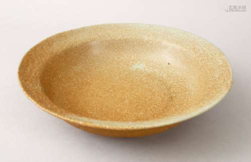 A GOOD CHINESE TEA DUST GLAZED PORCELAIN BOWL, with moulded lappet underside, 24cm diameter.