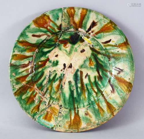 A 9TH/10TH CENTURY PERSIAN NISHAPUR GLAZED POTTERY DISH, 34cm diameter.