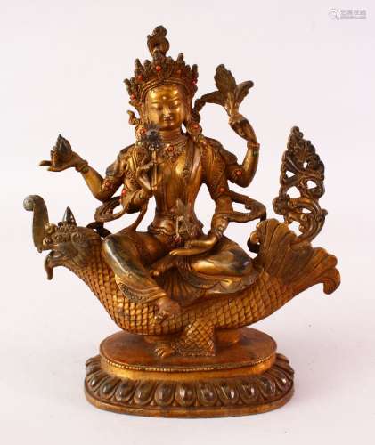 A CHINESE GILT BRONZE FIGURE OF A MULTI ARM DEITY, the verso with Chinese engraved signature mark,