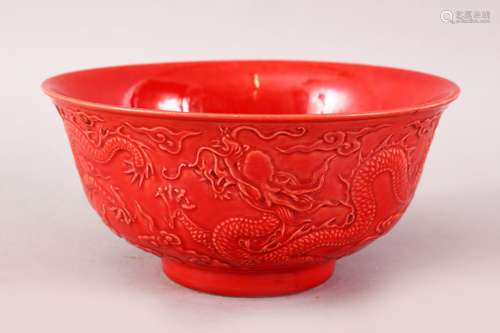 A GOOD CHINESE CORAL RED DRAGON BOWL, the side decorated with dragins chasing the pearl, the base