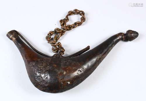 AN 18TH CENTURY NORTH INDIAN MUGHAL ISLAMIC BRASS POWDER FLASK, with carved floral decoration,