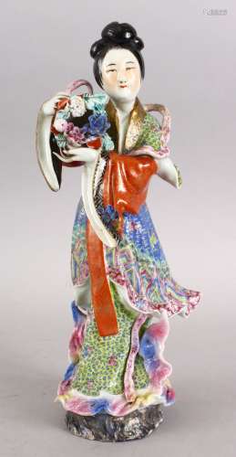 A GOOD CHINESE REPUBLIC PERIOD FAMILLE ROSE PORCELAIN FIGURE OF LAN CAIHE, brightly decorated and