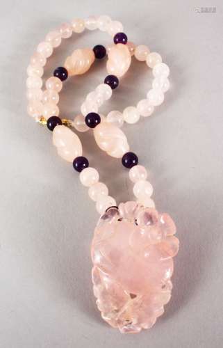 A GOOD CHINESE CARVED ROSE QUARTZ BEAD NECKLACE AND PENDANT, the pendant carved to depict fruit