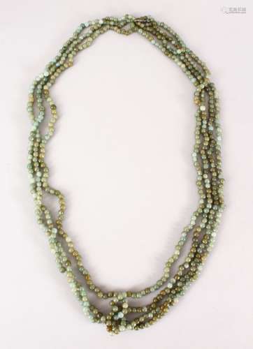A GOOD CHINESE CARVED JADE / HARD STONE BEAD NECKLACE, with seven runs of beads, Approx 55cm.