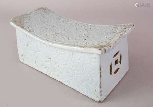 A GOOD CHINESE POSSIBLY MING CELADON PORCELAIN PILLOW, with pierced ends and carved floral decor,