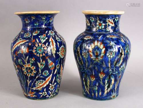 TWO GOOD 20TH CENTURY PALESTINIAN POTTERY VASES, both decorated in a similar manner with a deep blue