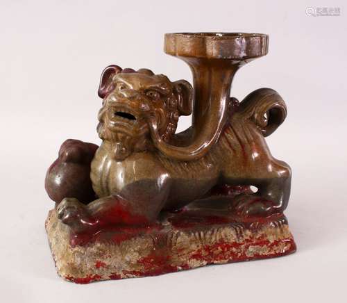 A LARGE CHINESE FLAMBE STYLE POTTERY FIGURE / CANDLESTICK OF A LION DOG, the dog in a recumbent