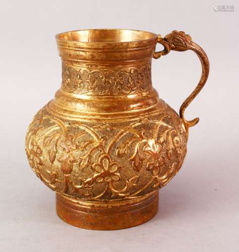 A GOOD 19TH CENTURY TURKISH OTTOMAN GILDED JUG, the body with carved floral decoration, 14.5cm