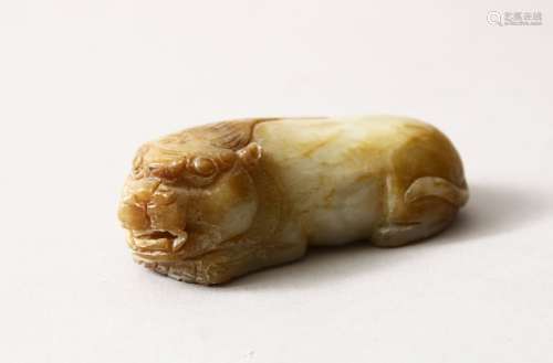 A CHINESE CARVED JADE / HARD STONE FIGURE OF A RECUMBENT KYLIN, 7.5cm.