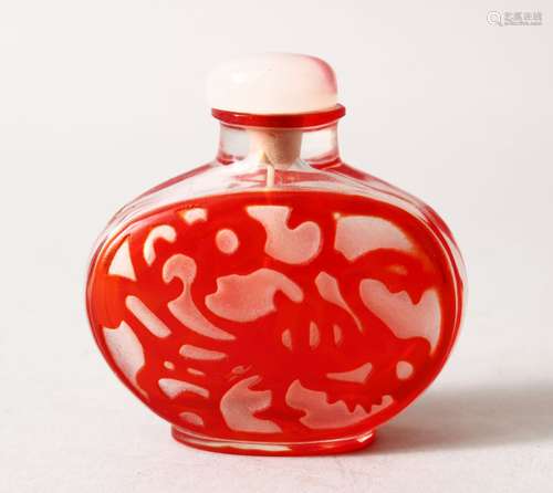 A19TH / 20TH CENTURY CHINESE RED OVERLAY GLASS SNUFF BOTTLE, depicting kylin and flora, with hard