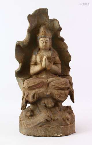 A LATE 19TH CENTURY CHINESE CARVED WOODEN FIGURE OF SEATED GUANYIN, with poly chromed decoration,