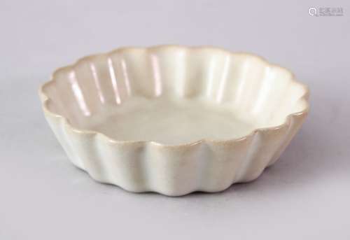 A GOOD CHINESE SONG STYLE DINGYAO MOULDED PETAL SAUCER DISH, with deep tapering sides rising from