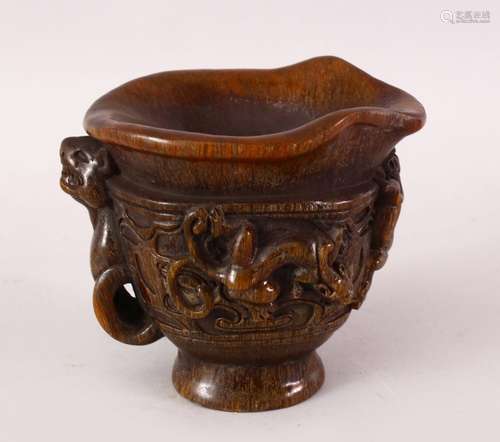 A CHINESE CARVED HORN LIBATION CUP, The cup carved in relief with chilong over archaic design,