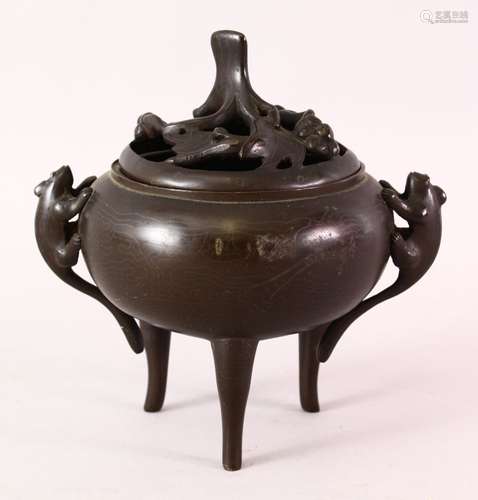 A CHINESE TRIPLE FOOt BRONZE CENSER, the censer with triple long feet, twin moulded mythical