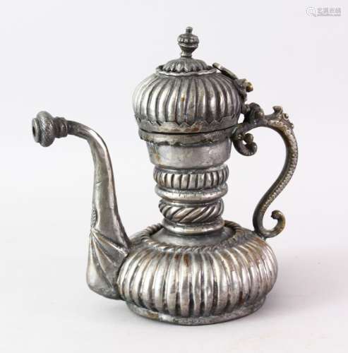 AN UNUSUAL TURKISH TINNED COPPER EWER, with a moulded body, 19.5cm high x 18.5cm
