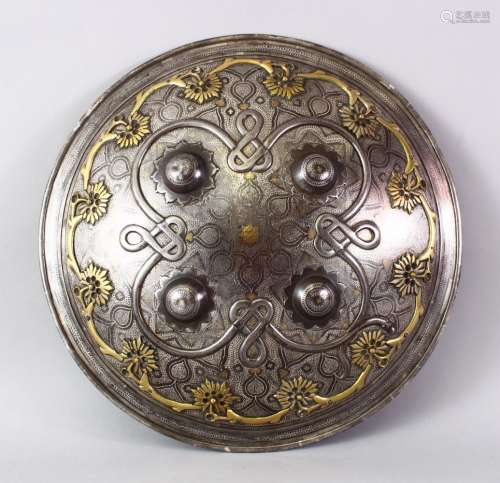 A VERY FINE INDIAN SILVER AND GOLD INLAID STEEL SHIELD, with raised stud decoration and onlaid
