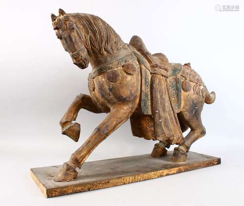 A GOOD AND LARGE CHINESE CARVED WOOD MODEL OF A STRIDING HORSE, with carved detailing and