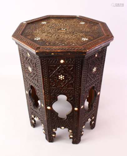 A 19TH CENTURY DAMASCUS ENGRAVED OCTAGONAL WOODEN TABLE, with mother of pearl inlays and carved