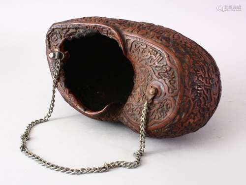 A GOOD 19TH CENTURY ISLAMIC CARVED COCO KASHKOOL WITH CALLIGRAPHY, the body with carved decoration