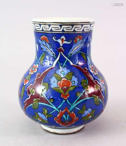 A GOOD IZNIK POTTERY VASE, the body of the vase decorates with native floral design, 12.5cm high.