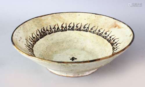 AN IRANIAN NISHABOUR POTTERY BOWL WITH CALLIGRAPHY AND CROSS, the inner decorated with calligraphy