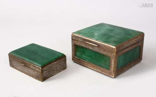 TWO INDIAN WHITE METAL MOUNTED JADEITE BOXES, With chased side border design, 6cm high x 10cm x