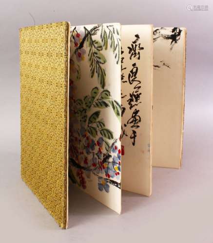 A GOOD 19TH / 20TH CENTURY CHINESE SILK BOUND BOOK OF PAINTINGS BY LI KUSHAN, The book opening to