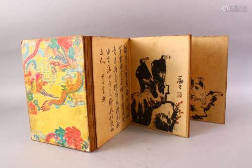 A GOOD 19TH / 20TH CENTURY CHINESE SILK BOUND BOOK OF PAINTING / INK WORK OF BIRDS, the book opening