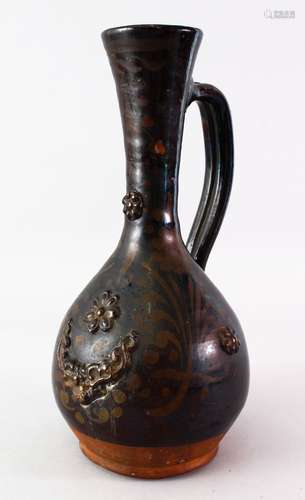 A GOOD OTTOMAN TURKISH CHANAKKALE POTTERY JUG, with moulded decoration, 33cm high x 18cm.