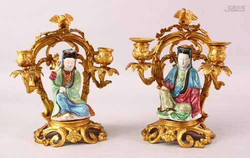 A GOOD PAIR OF 19TH CENTURY FAMILLE ROSE PORCELAIN FIGURES OF GUANYIN ON ORMOLU MOUNTED