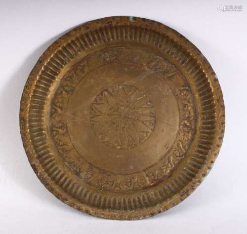 A 19TH CENTURY INDAIN BRASS CHARGER / DISH, with embossed decoration, 23cm