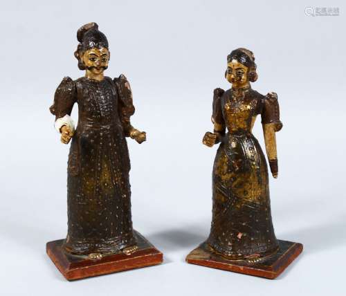 TWO INDIAN KASHMIRI / MUGHAL CARVED WOOD & LACQUER FIGURES, both mounted upon wooden bases,
