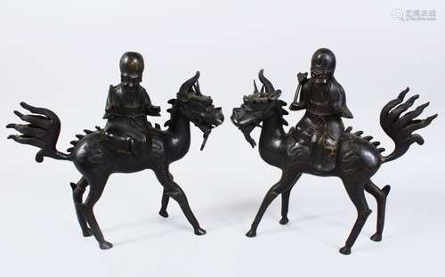 TWO 19TH CENTURY OR EARLIER CHINESE BRONZE CENSERS IN THE FORM OF MYTHICAL BEASTS, upon the backs