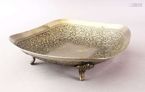 A GOOD 19TH CENTURY INDIAN WHITE METAL EMBOSSED DISH, decorated to depict scrolling floral scenes,