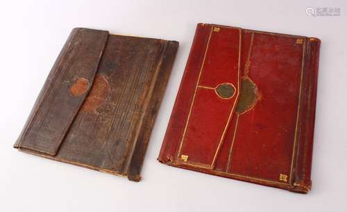 TWO 17TH CENTURY TURKISH OTTOMAN OR PERSIAN TOOLED LEATHER BOOK BINDINGS, 31CM X 24CM & 28.5 X