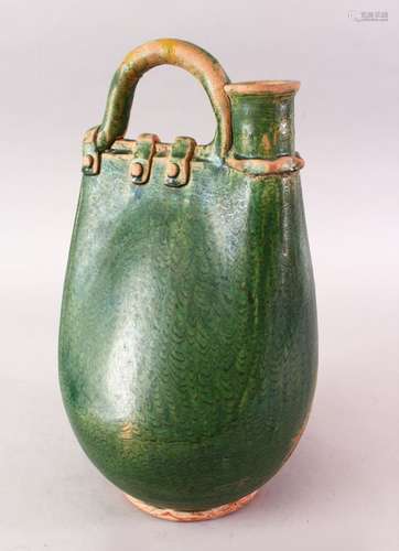 A CHINESE TANG DYNASTY GREEN GLAZED POTTERY POWDER FLASK SHAPED JUG, in the form of a stylized