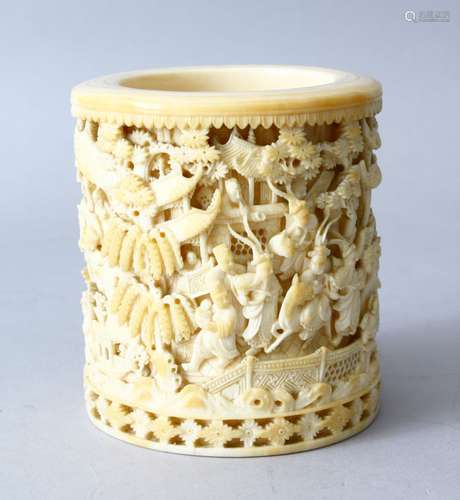 A FINE QUALITY 19TH CENTURY CHINESE CARVED IVORY VASE, the cylindrical vase carved in deep relief to