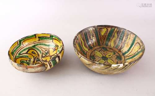 TWO EARLY ISLAMIC PERSIAN 10TH / 12TH CENTURY POTTERY BOWLS, 18cm & 14 cm.